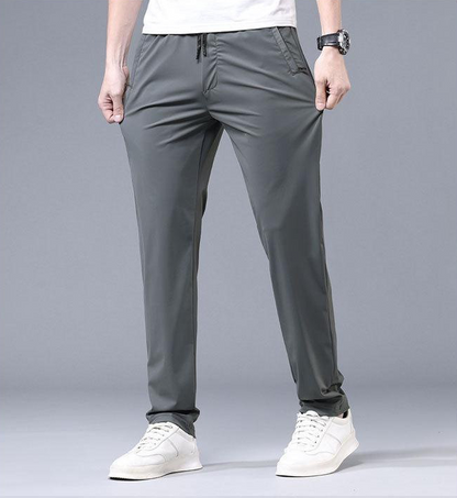 ❄️👖【Kupte 1 a získejte 1 zdarma ✨】【M–5XL】Letní tenké pánské rovné kalhoty z ledového hedvábí ✅ Vysoká elasticita ✅ Prodyšné a rychleschnoucí